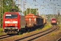 Cargo class locomotive with colorful wagons passing through Saarmund, Germany