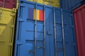 Cargo container with products of Romania and printed national flag. Logistics related 3D rendering