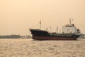 Cargo container ship at Gulf of Thailand coast in sunset Royalty Free Stock Photo