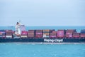 Cargo ship sailing through peaceful, calm, blue sea. Royalty Free Stock Photo