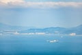 Cargo Container Ship on the sea near the coast and mountains Royalty Free Stock Photo