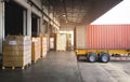 Cargo Container Truck Parked Loading at Dock Warehouse. Cargo Shipment. Industry Freight Truck Transportation. Royalty Free Stock Photo