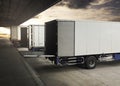 Cargo Container Truck Parked Loading at Dock Warehouse. Cargo Shipment. Industry Freight Truck Transportation. Shipping Warehouse. Royalty Free Stock Photo