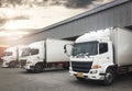 Cargo Container Trucks Parked Loading at Dock Warehouse. Shipping Warehouse Logistics.Cargo Shipment. Freight Truck Transport. Royalty Free Stock Photo