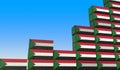 Cargo containers with flags of Sudan making a rising graph. Economic growth related 3D rendering