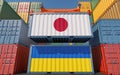 Cargo containers with Japan and Ukraine national flags.