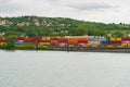 Cargo containers at the railway container terminal near the river.