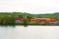 Cargo containers at the railway container terminal near the river.