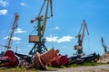 Cargo cranes in the seaport. Large iron buoys in the port