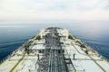 Cargo deck of crude oil tanker in the calm sea.