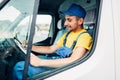 Cargo delivery, driver courier sitting in truck Royalty Free Stock Photo