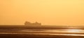 Cargo ferry ship, windfarm, sunset, Morecambe Bay Royalty Free Stock Photo