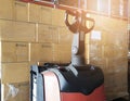 Cargo freight, Shipment, Warehousing service. stack of cardboard boxes on pallet with forklift pallet jack in the warehouse. Royalty Free Stock Photo