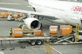 Cargo handling containers into an aircraft