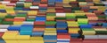 Cargo industrial containers stacked in rows of different colors