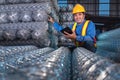 Cargo Inspection worker Rolls of steel wire mesh for construction work in warehouse