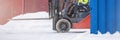 Cargo loader in winter on snow. The loader ride on snow with chains on the wheels to reduce slippage and spin. Driving