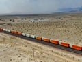 Cargo locomotive railroad engine crossing Arizona desert wilderness