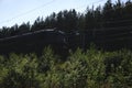 Cargo locomotive railroad engine crossing desert wilderness,rails Royalty Free Stock Photo