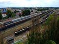 Cargo and passanger wagons on train station in city, aerial view Royalty Free Stock Photo