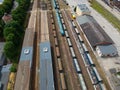 Cargo and passanger wagons on train station in city, aerial view Royalty Free Stock Photo