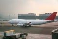 Cargo plane double decker fuselage without windows taxiing along the apron to the cargo terminal Royalty Free Stock Photo