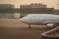 Cargo plane double decker fuselage without windows taxiing along the apron to the cargo terminal Royalty Free Stock Photo