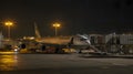 Cargo Plane at Night Loading Dock with Floodlights Royalty Free Stock Photo