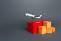 Cargo plane over container and boxes. Services of express delivery and transportation of goods by plane. World trade and logistics