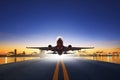 Cargo plane take off from airport runways against ship port back