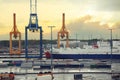 Cargo port in Helsinki. Harbor cranes in sea cargo port with ship. Helsinki, Finland