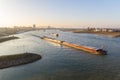 Cargo river barges passing near Nijmegen during time of low river levels