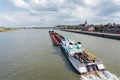 Cargo riverboat passing the Dutch city Nijmegen Royalty Free Stock Photo