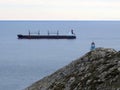 Cargo sailing past Cape Tainaro, Greece Royalty Free Stock Photo