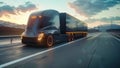 A cargo semi-truck drives down a highway during sunset, casting a long shadow on the road Royalty Free Stock Photo