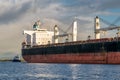 Cargo ship being docked by Tug Boat Royalty Free Stock Photo