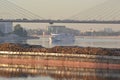 Cargo ship and cable-braced bridge Royalty Free Stock Photo