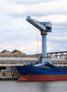 Cargo ship, containers and crane Royalty Free Stock Photo