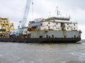 The cargo ship with the crane, the top view. Pipelaying barge.