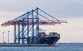 Cargo ship and Dockyard cranes Royalty Free Stock Photo