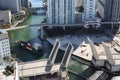 Cargo ship entering the Miami River in Downtown Miami. A divorced bridge. Passage of a cargo ship under the bridge. Taken from the Royalty Free Stock Photo