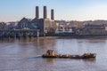 Cargo ship with full load, travelling up the Thames and passing Royalty Free Stock Photo