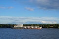 Cargo ship goes along the river