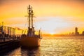 Cargo ship in the harbor at commercial port at sunset time