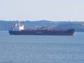 A cargo ship lies off the English coast near Falmouth Cornwall