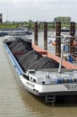 Cargo ship loaded with coal docked in Harbour Royalty Free Stock Photo