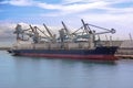 Cargo ship loading in coal
