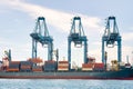 Cargo ship loading cargo container with crane at port Royalty Free Stock Photo