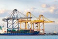 Cargo ship loading cargo container with crane at port Royalty Free Stock Photo