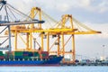 Cargo ship loading cargo container with crane at port Royalty Free Stock Photo